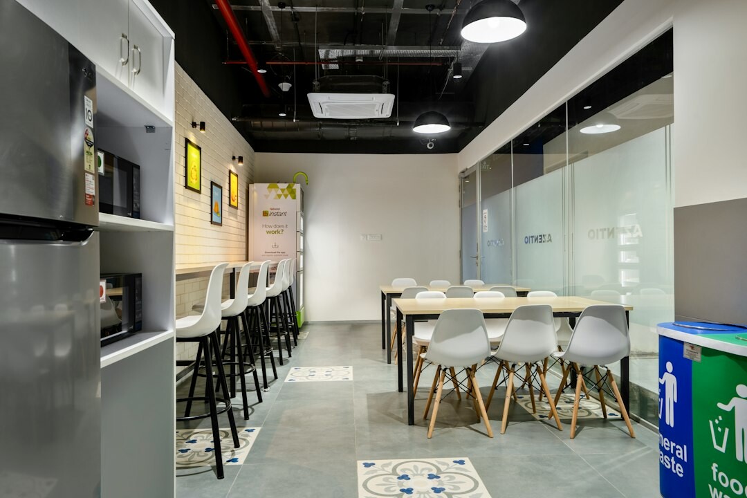 Modern newsroom office with computer screens and editorial boards